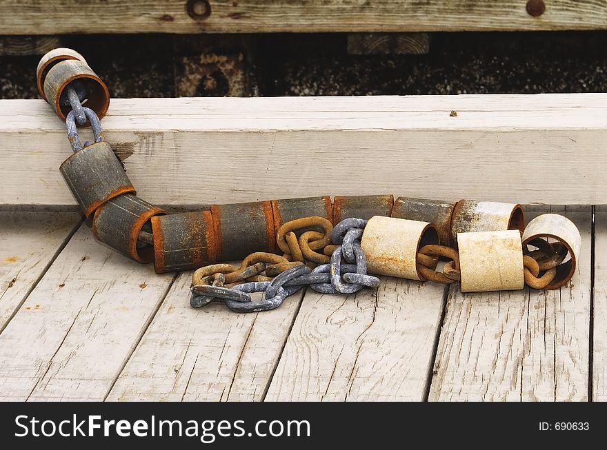 A chain mooring on a boat dock along the coast. A chain mooring on a boat dock along the coast.