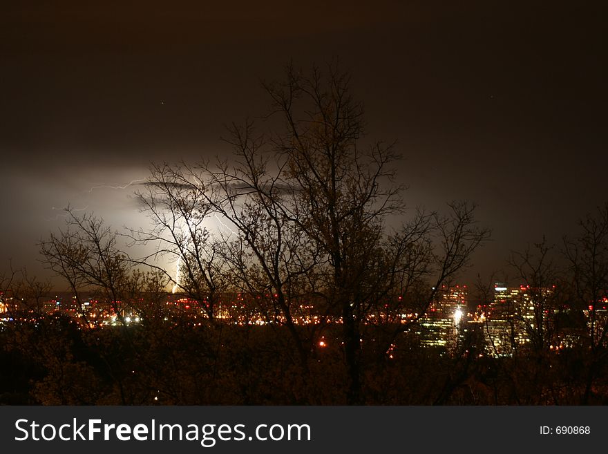 Lightening behind trees in Arlington. Lightening behind trees in Arlington