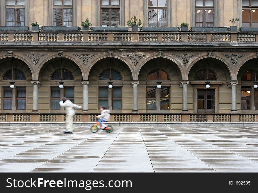 Two kids playing on square, Prague, Czech Republic. Two kids playing on square, Prague, Czech Republic