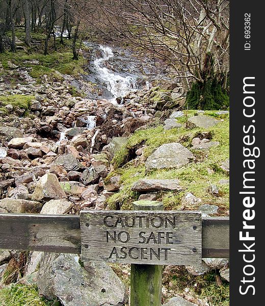 Stream running down a mountain side towards a lake. Stream running down a mountain side towards a lake