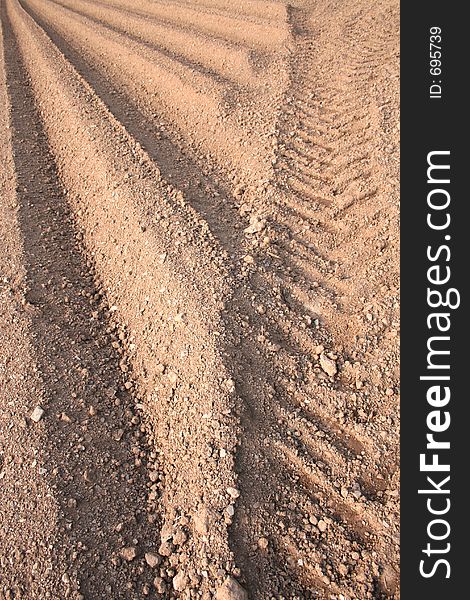 Ploughed furrows in farmers potato field. Ploughed furrows in farmers potato field