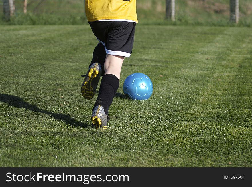 Young Boy Playing Youth Soccer