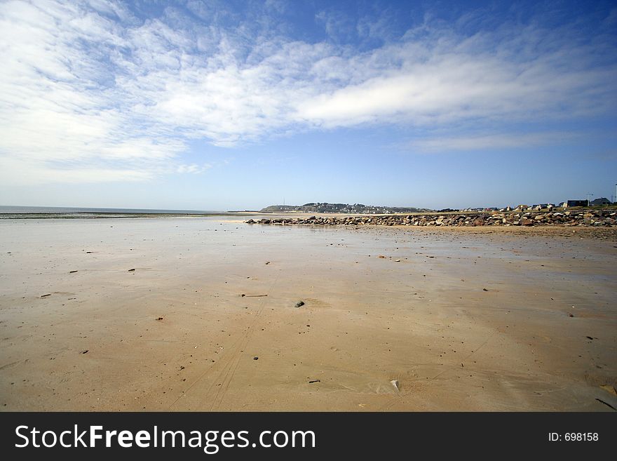 A large empty beach in carteret, normandy, france. A large empty beach in carteret, normandy, france