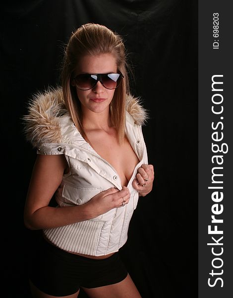 Model wearing winter jacket and shades. Model wearing winter jacket and shades