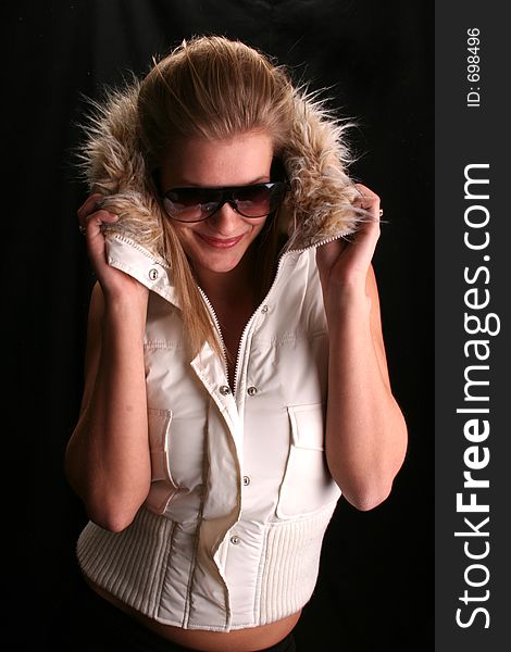 Model wearing shades and a winter jacket. Model wearing shades and a winter jacket