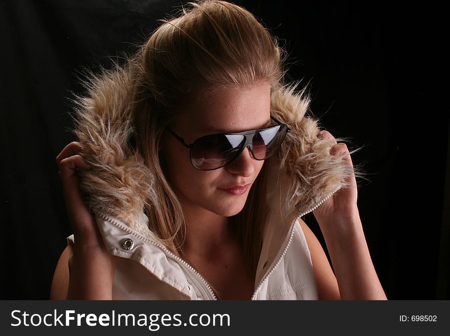 Model wearing winter jacket and shades. Model wearing winter jacket and shades