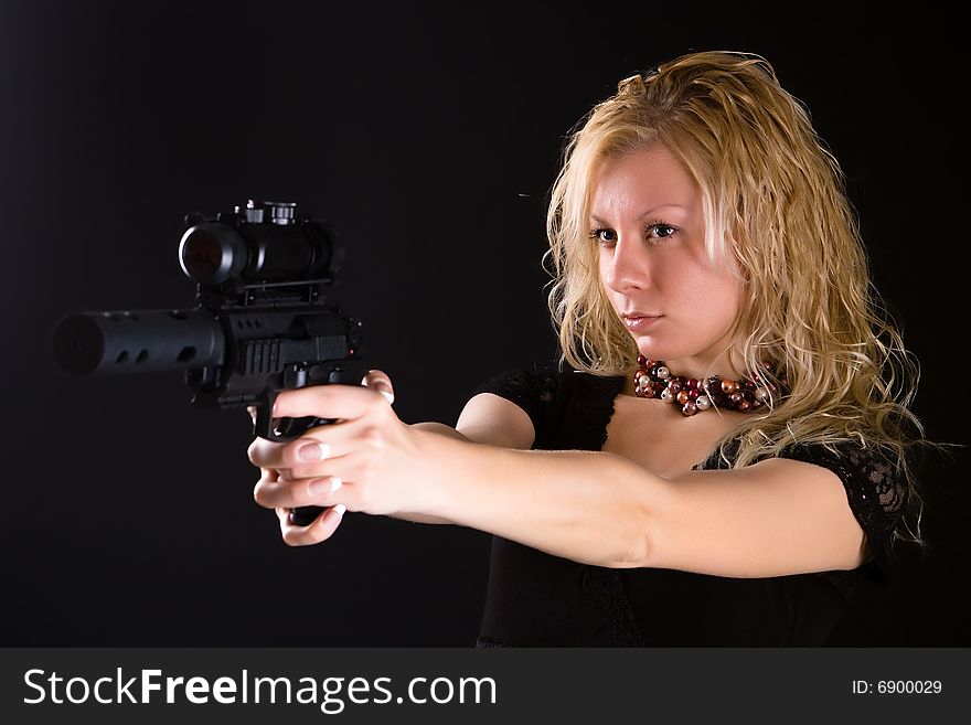 Girl aiming at a sight of a pistol