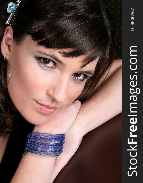 Female model with intense eyes wearing beautiful jewelery