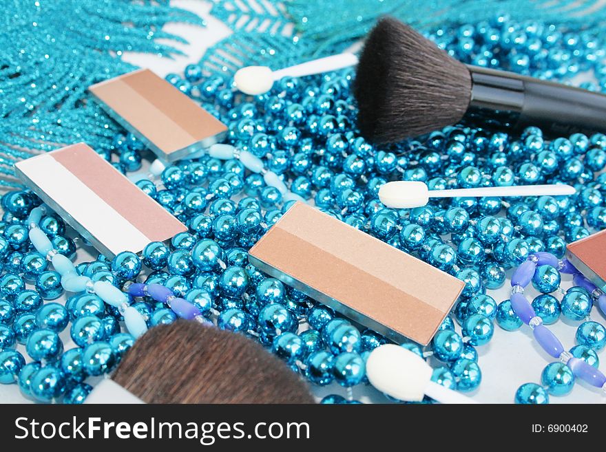 Multi-coloured cosmetics with a blue beads