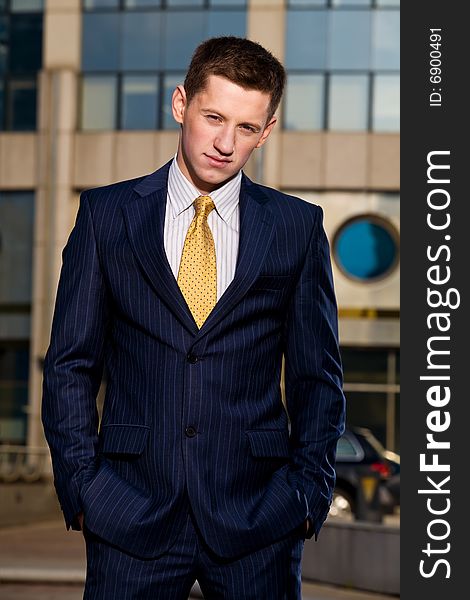 Portrait of young businessman outdoors