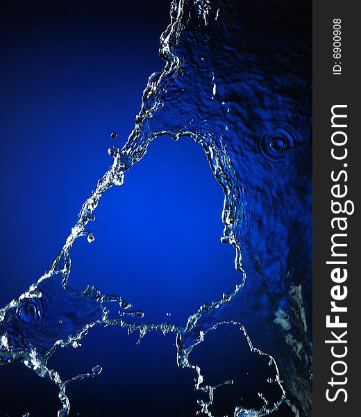 Falling water on blue. Very high resolution. Falling water on blue. Very high resolution.