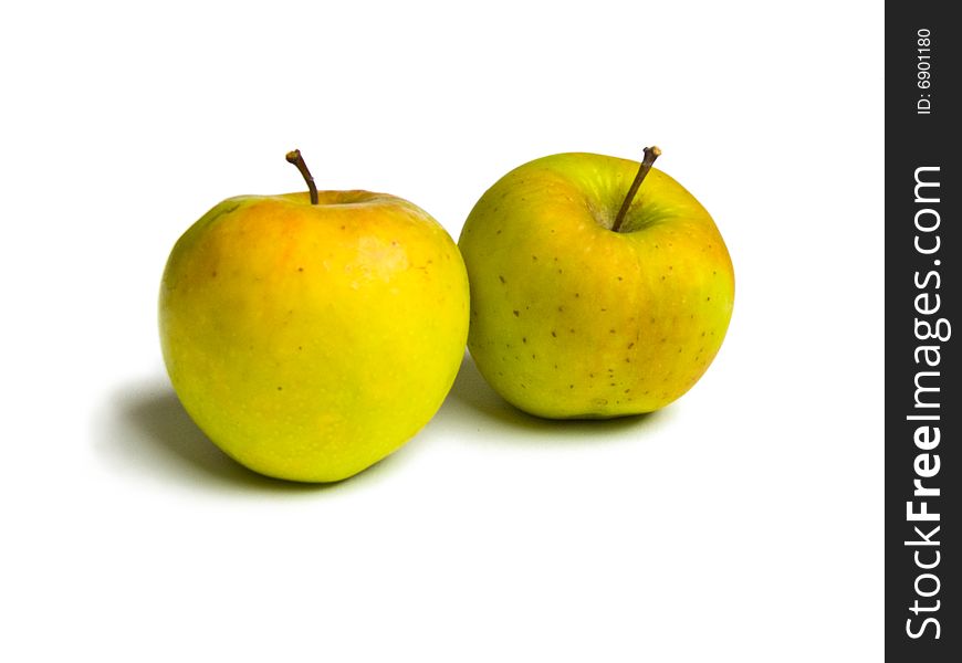 Two ripe apples lying on a white background. Two ripe apples lying on a white background