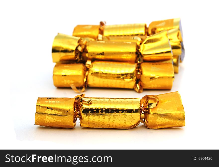 Shot of some gold coloured christmas crackers