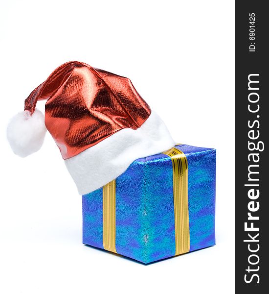 Santa's red hat and gift box on a white background