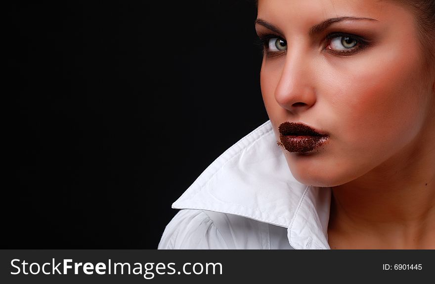 Portrait of beautiful young woman with milled coffee on her lips. Portrait of beautiful young woman with milled coffee on her lips