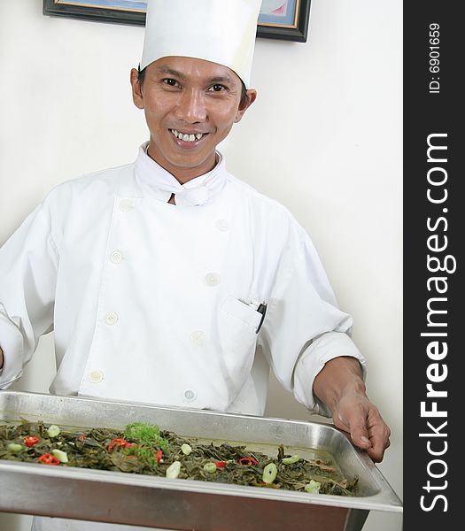 Chef holding food for buffet