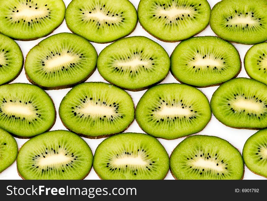 Slices of kiwi fruits isolated on white background