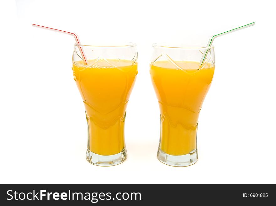 Two glasses of orange juice on white