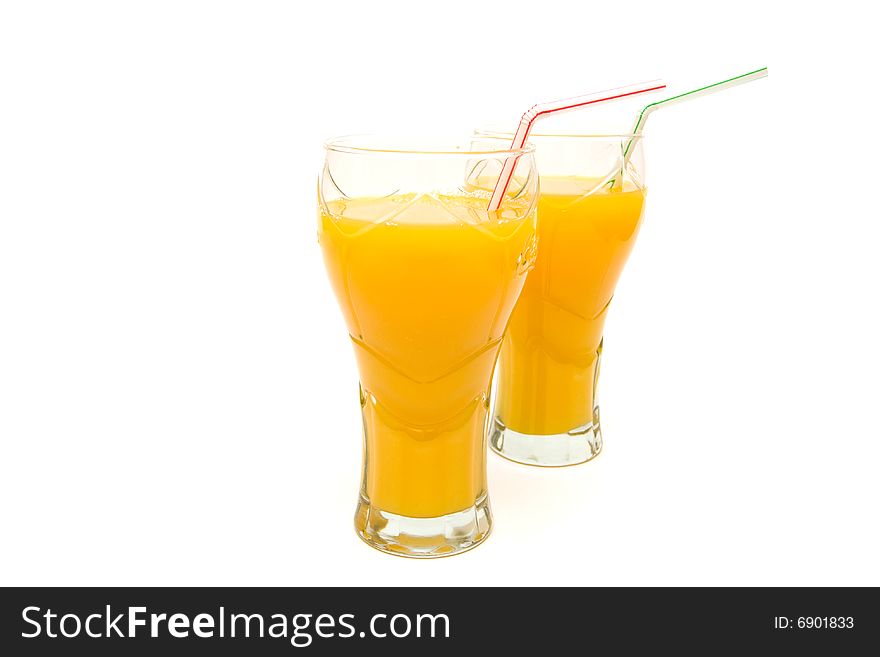 two glasses of orange juice on white