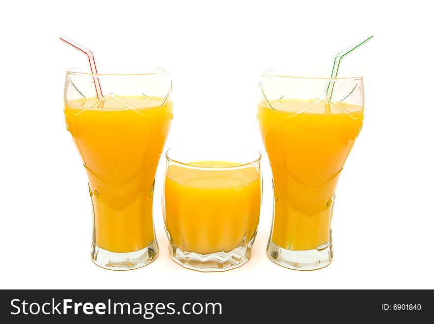 three glasses of orange juice on white