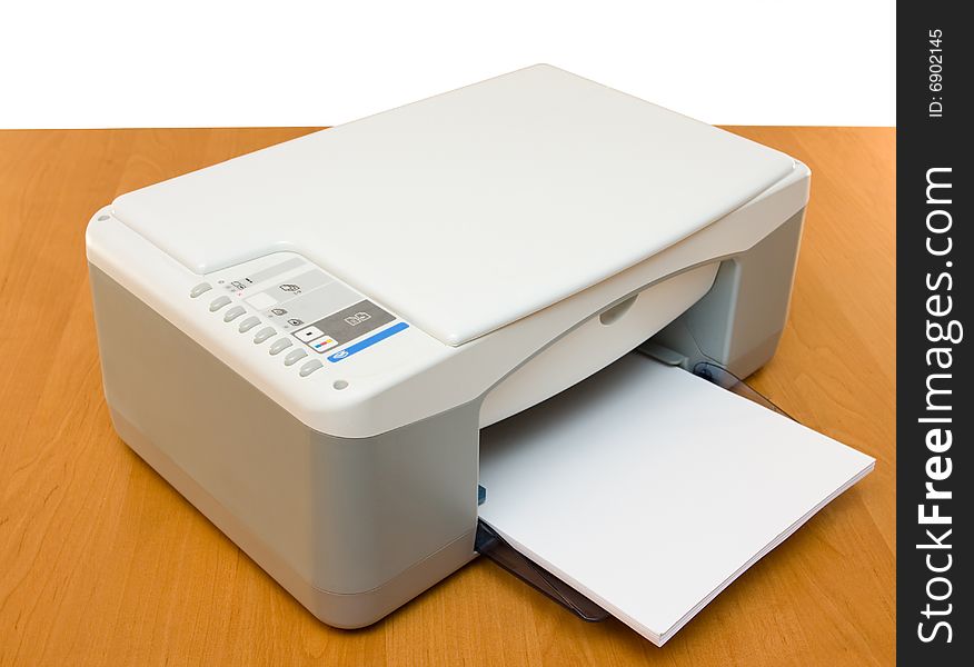 Ink-jet printer placed on a wood table