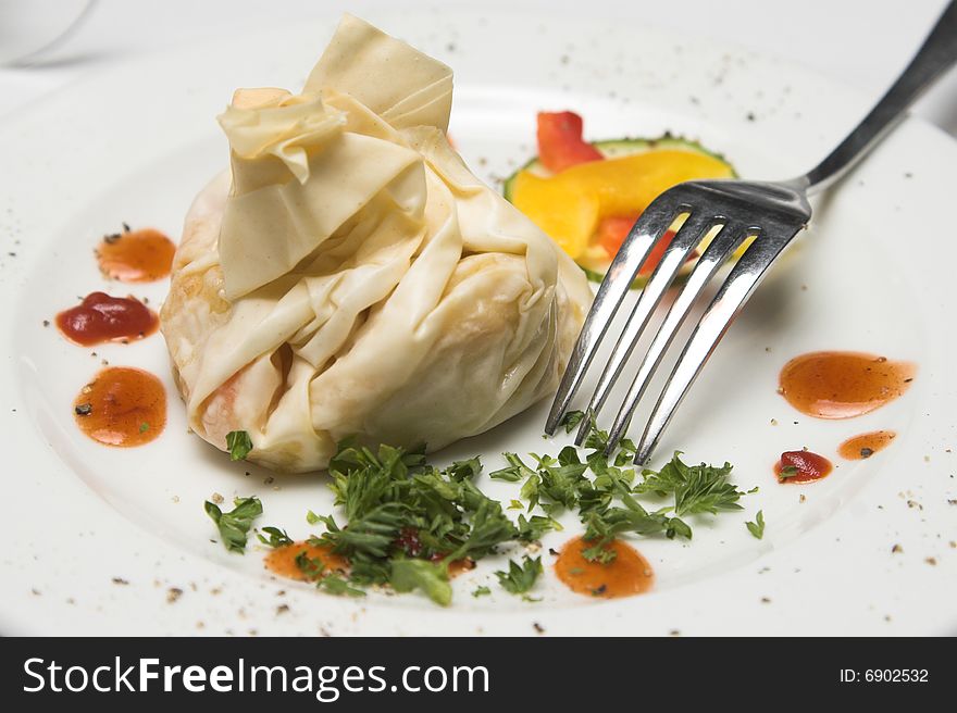 Starter on a plate with fork and garnish