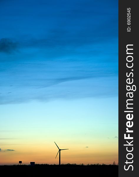 Wind turbine at dask, beautiful sunset. Wind turbine at dask, beautiful sunset