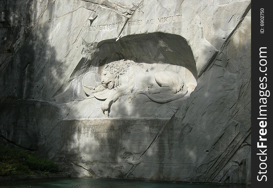 Switzerland - swiss symbol , a sleeping lion on a rock side at Lucerne City
