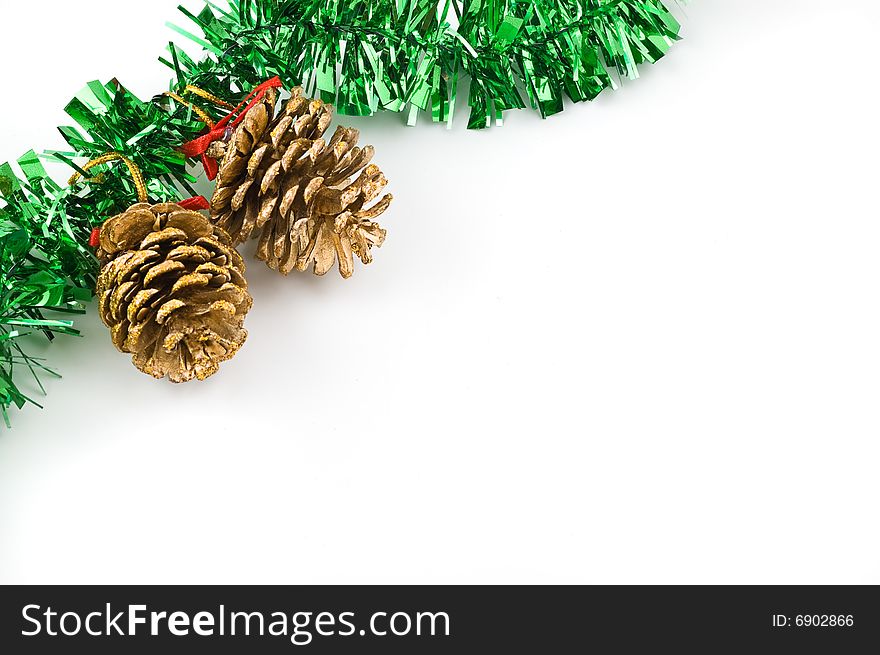 Two golden cones. Christmas decoration isolated on white background.