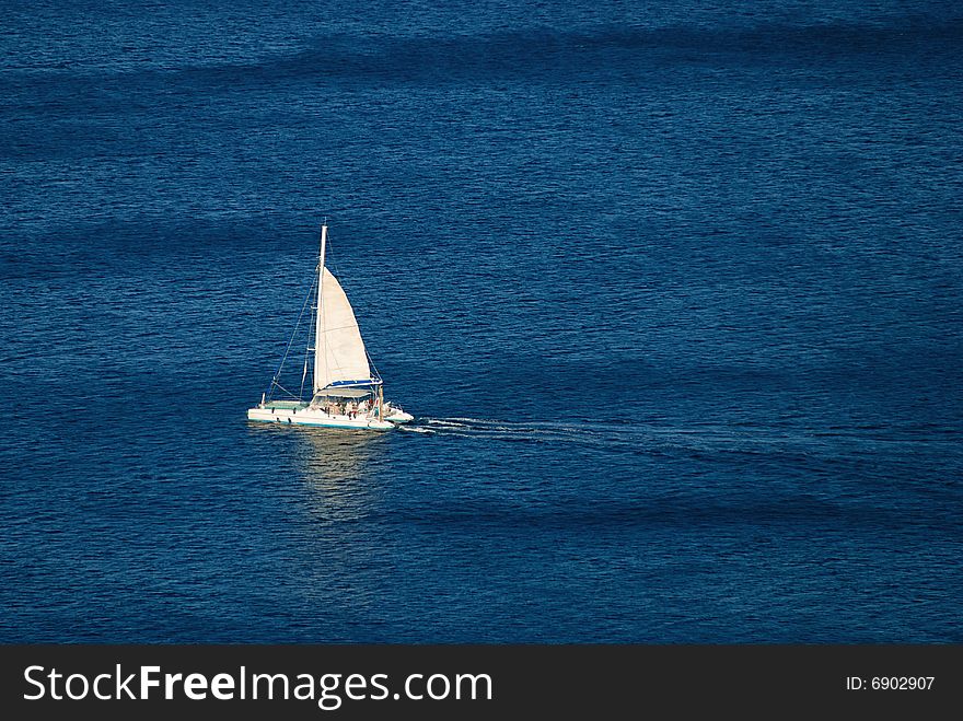 White yacht on the blue sea (view from above)