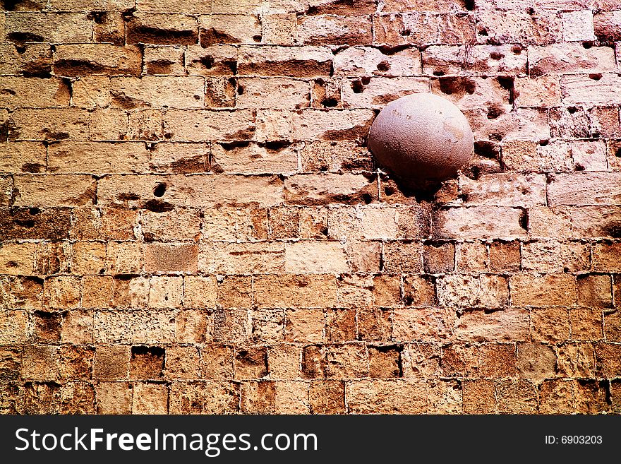 A medieval cannonball stuck in the city walls