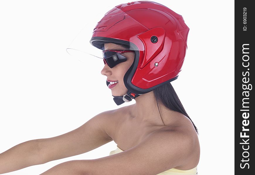 A sexy female with red helmet riding her bike