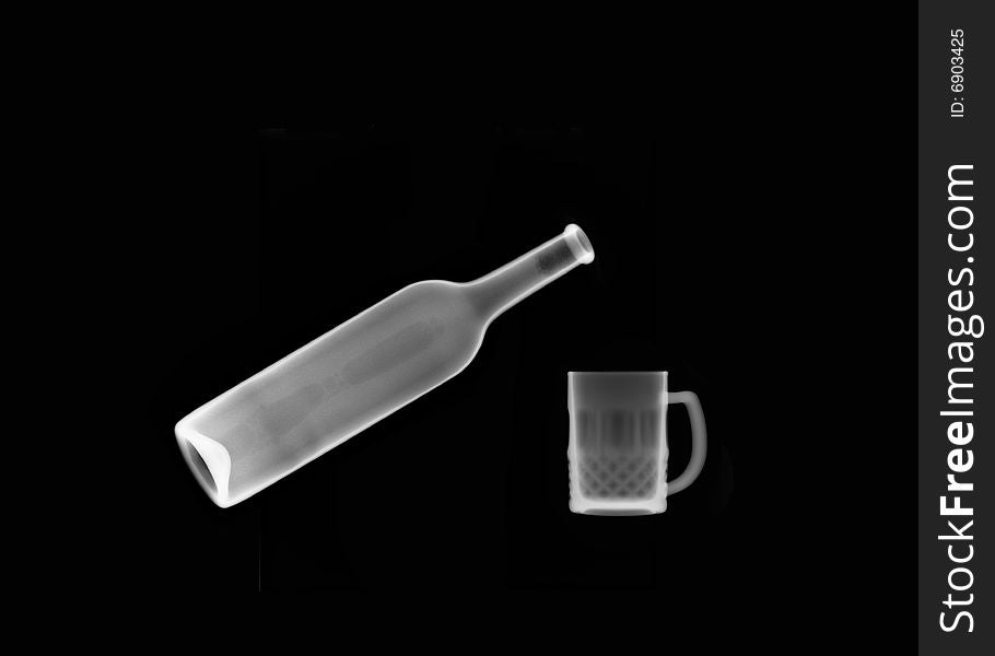 X-ray picture:bottle and mug on black background