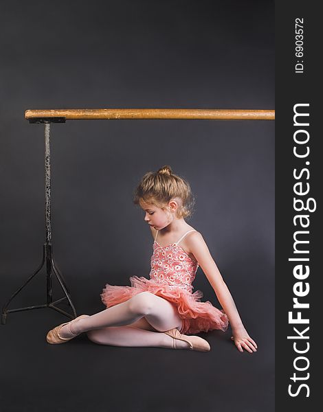 Young ballet dancer wearing an apricot tutu. Young ballet dancer wearing an apricot tutu