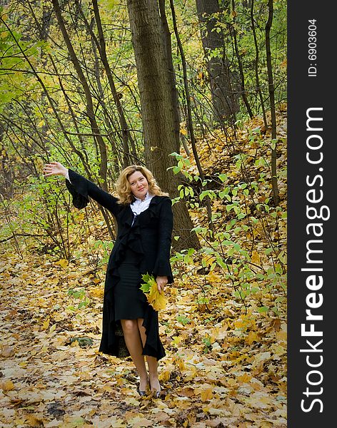 Middle age woman portrait in an autumn nature