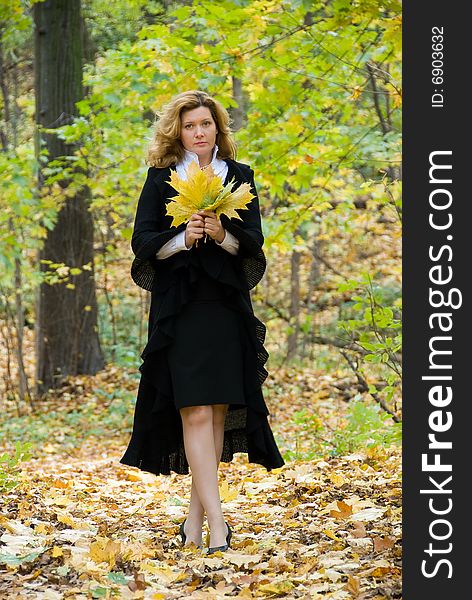 Middle age woman portrait in an autumn nature