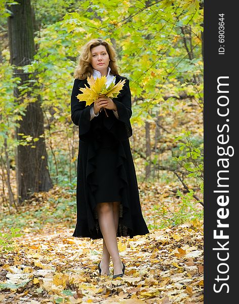 Middle age woman portrait in an autumn nature