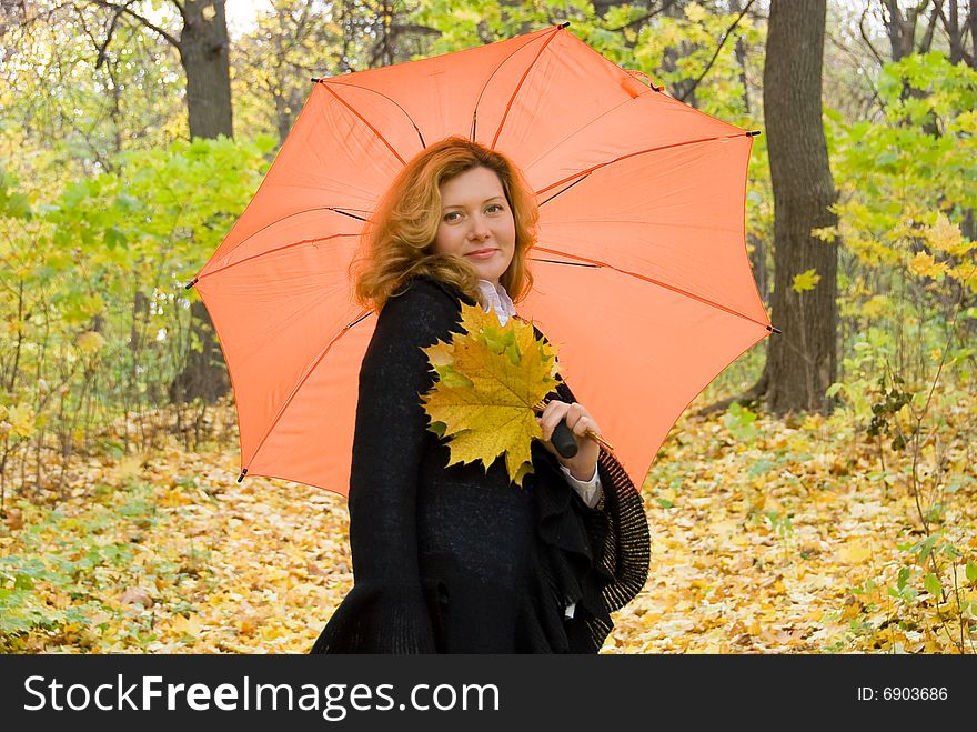 Middle age woman portrait in an autumn nature