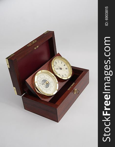 Old redwood box with watch and barometer inside. Old redwood box with watch and barometer inside