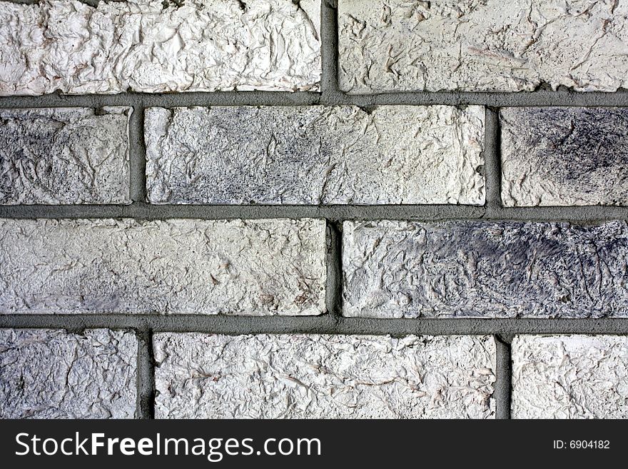 Part of gray brick wall. Part of gray brick wall