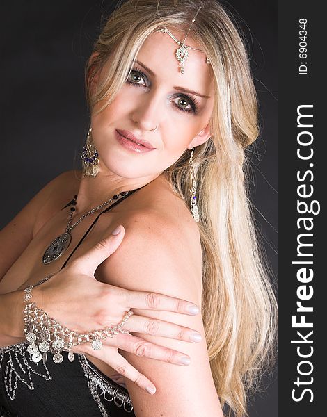 Beautiful Blond Belly Dancer with traditional jewelery