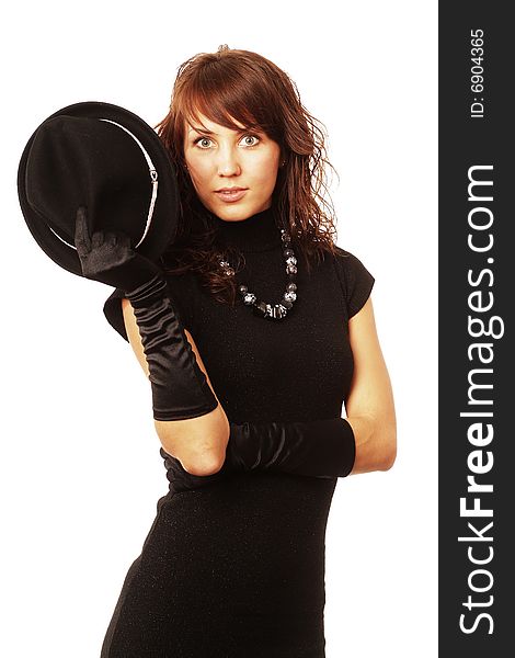 The girl in black clothes on a white background with a hat hat