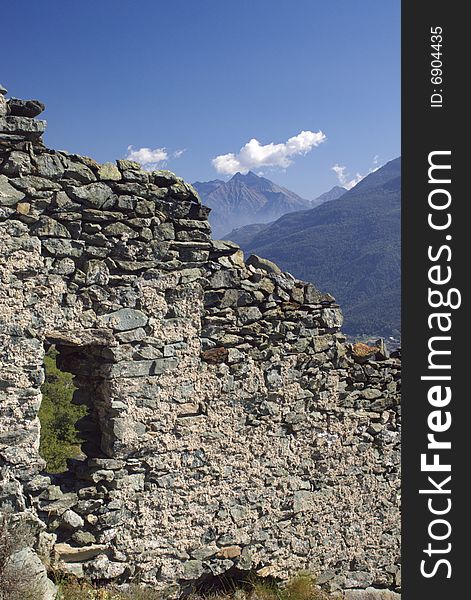 Ruins of walls of medieval castle in Italy, Aosta region, vertical. Ruins of walls of medieval castle in Italy, Aosta region, vertical