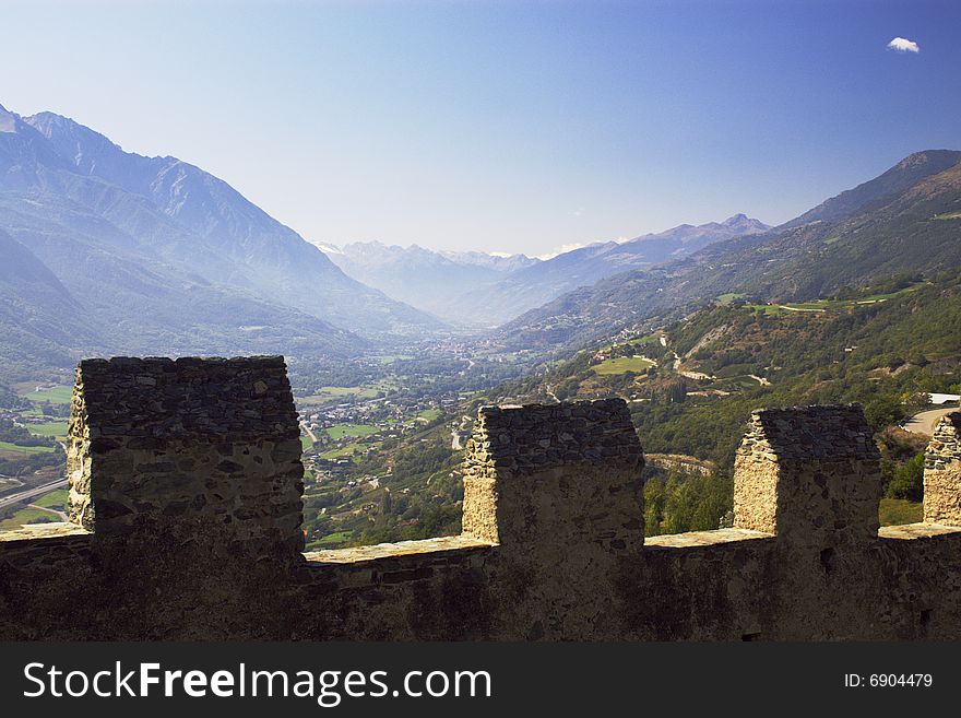 Mountain valley over the walls of medieval castle in Italy, Aosta region. Mountain valley over the walls of medieval castle in Italy, Aosta region.