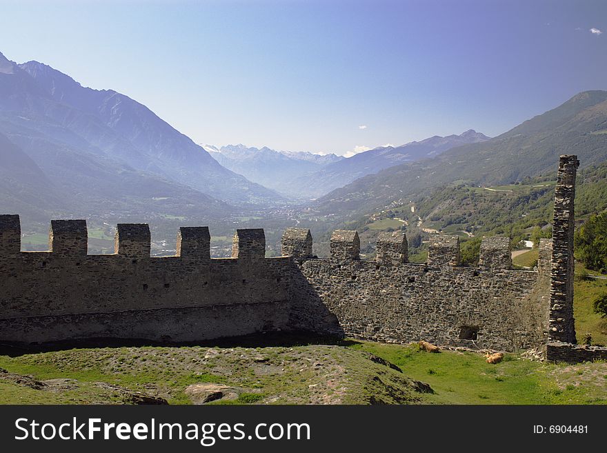 Mountain valley over the walls of medieval castle in Italy, Aosta region. Mountain valley over the walls of medieval castle in Italy, Aosta region.