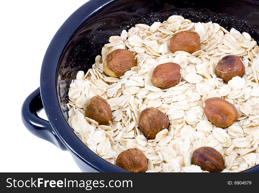 A bowl of oatmeal with hazelnuts - healthy diet