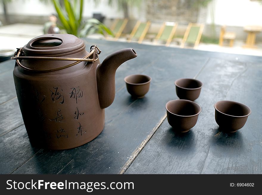 Tea set on the wooden table.