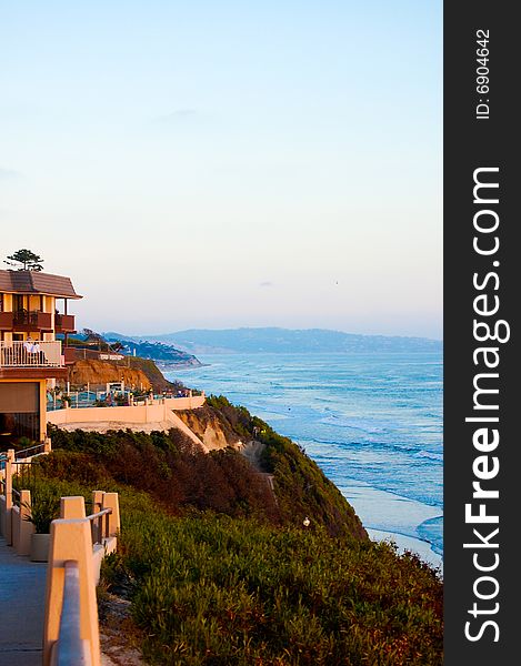 A seaside view of the ocean at sunset. A seaside view of the ocean at sunset