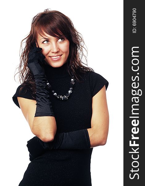 The girl in black clothes on a white background with a hat hat