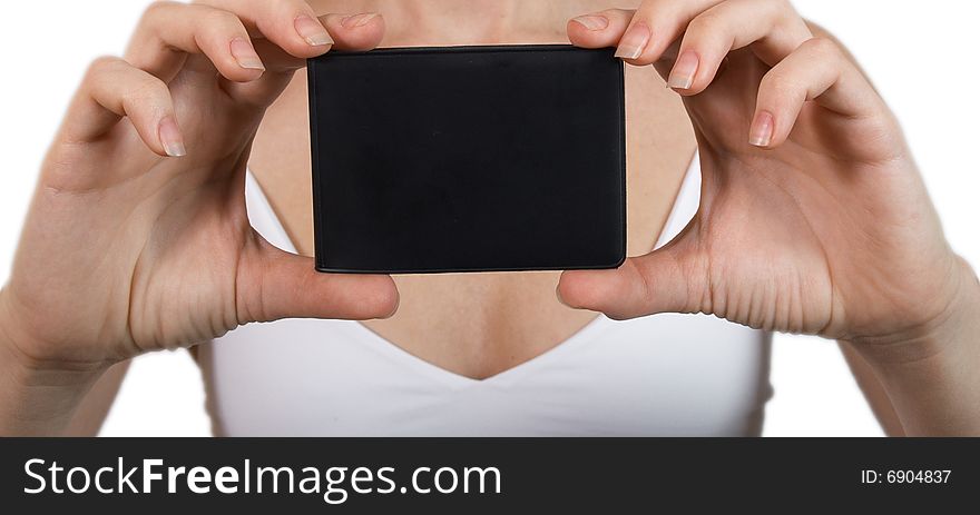 Female hands hold business a card of black colour. Female hands hold business a card of black colour